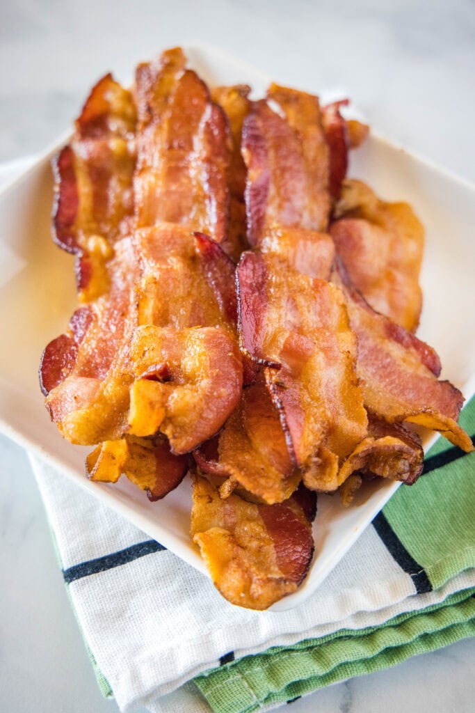 strips of bacon on a white plate