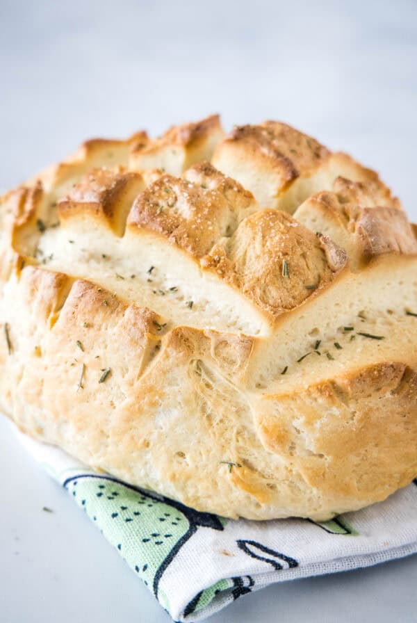 Baked Amish bread on top of a dishcloth.