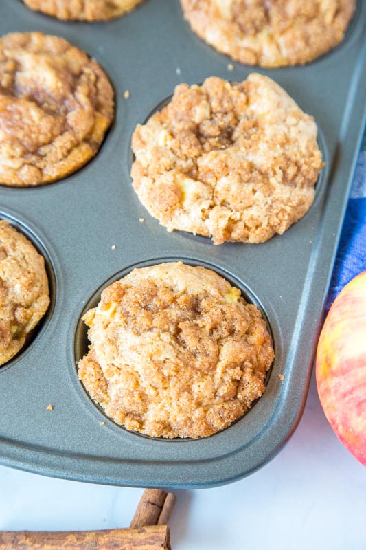 apple cinnamon muffins in muffin tin