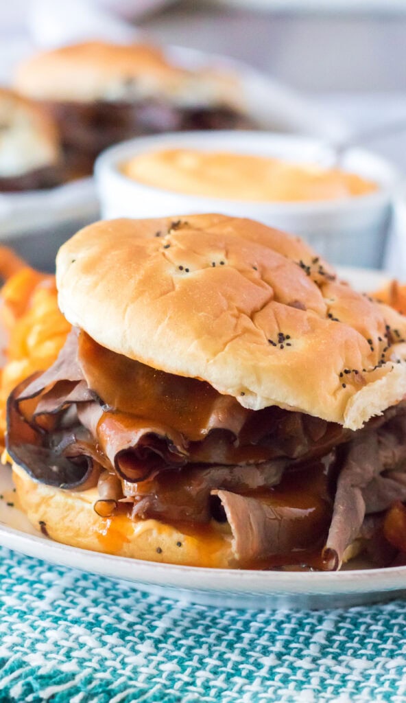 roast beef 7 cheddar sandwich on a white plate