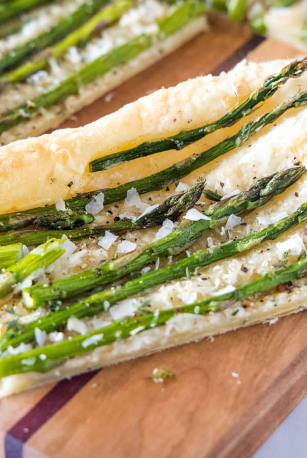 cropped close up sliced asparagus tart