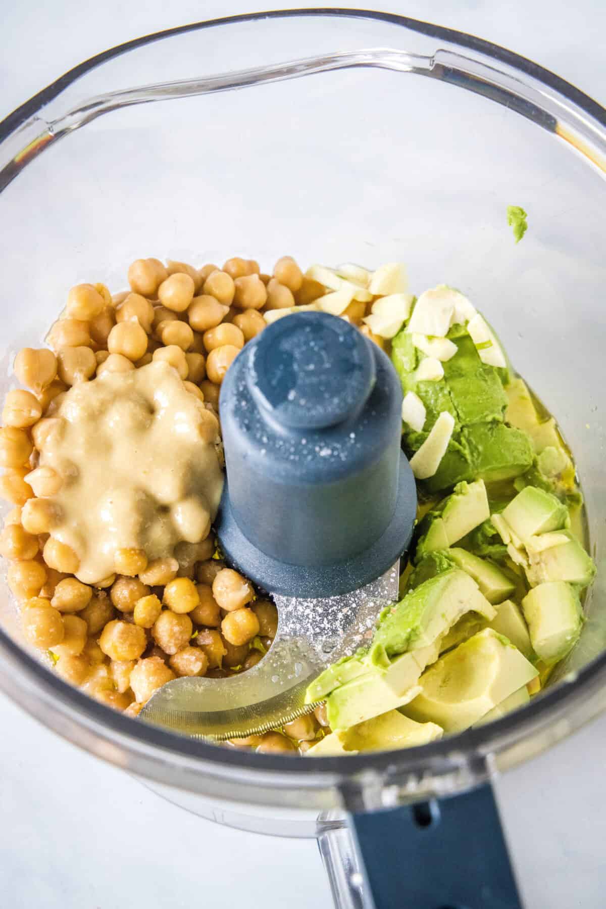 avocado hummus ingredients in a food processor