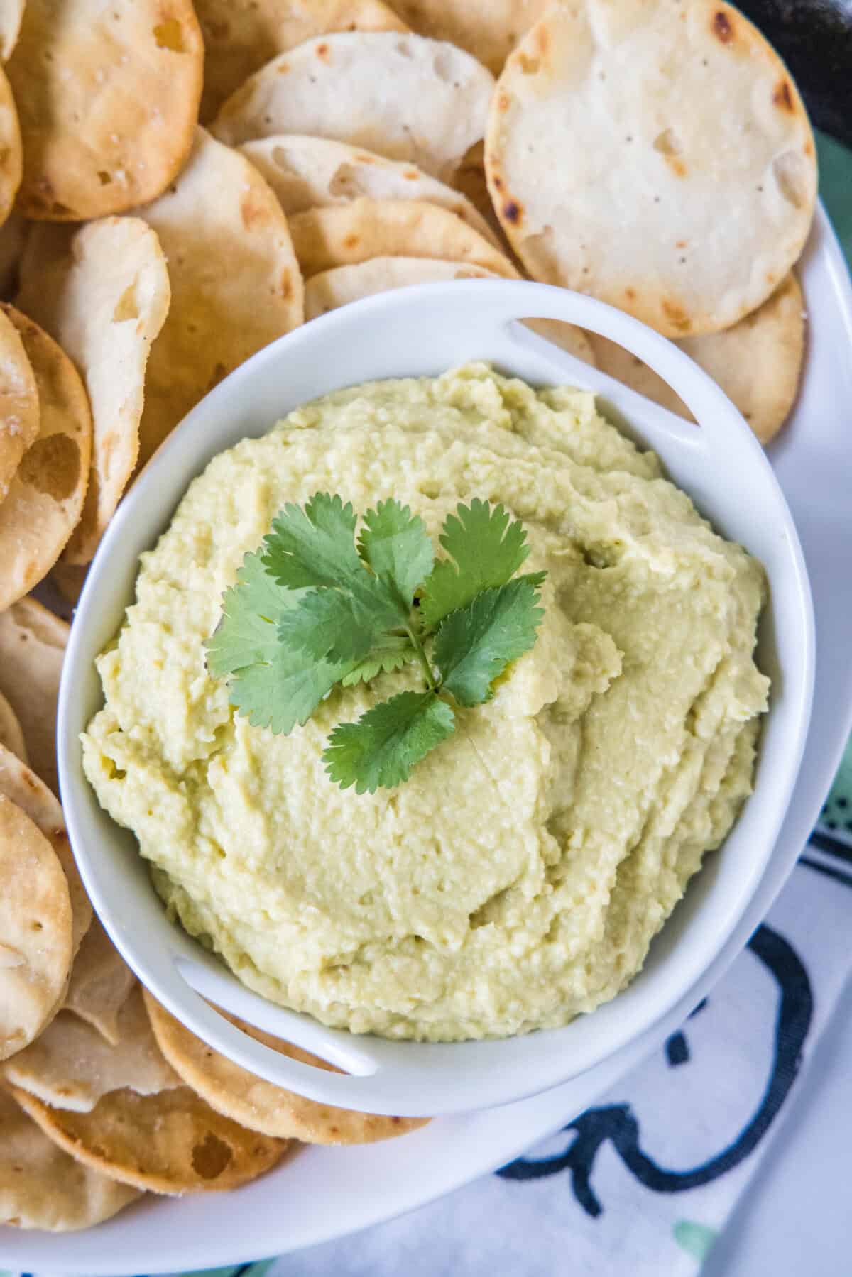 looking down on a bowl of avocado hummus