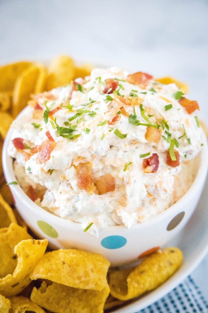 cheddar ranch dip in bowl with fritos around it