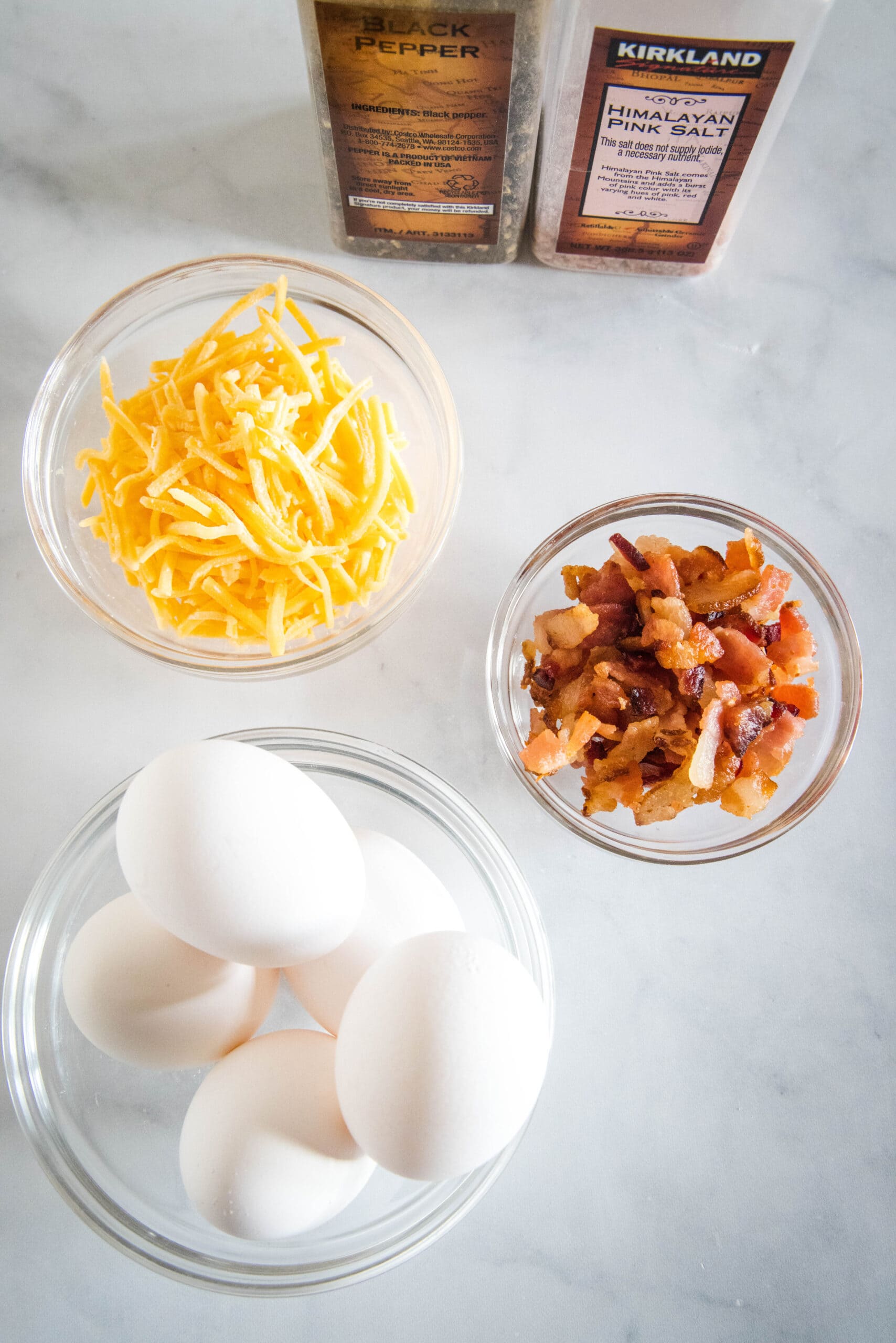 Ingredients needed for bacon cheese egg muffins.