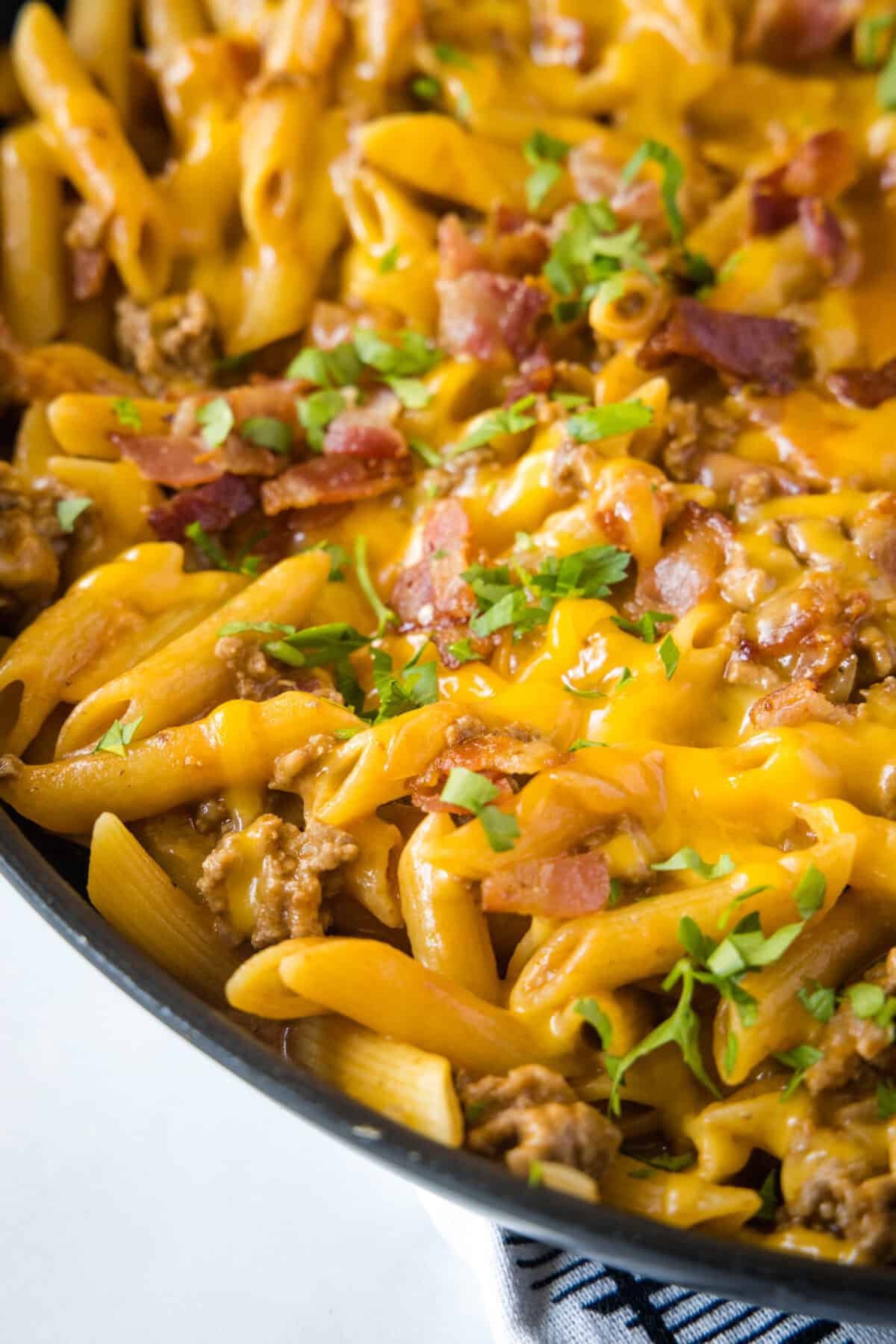 bacon cheeseburger pasta in skillet