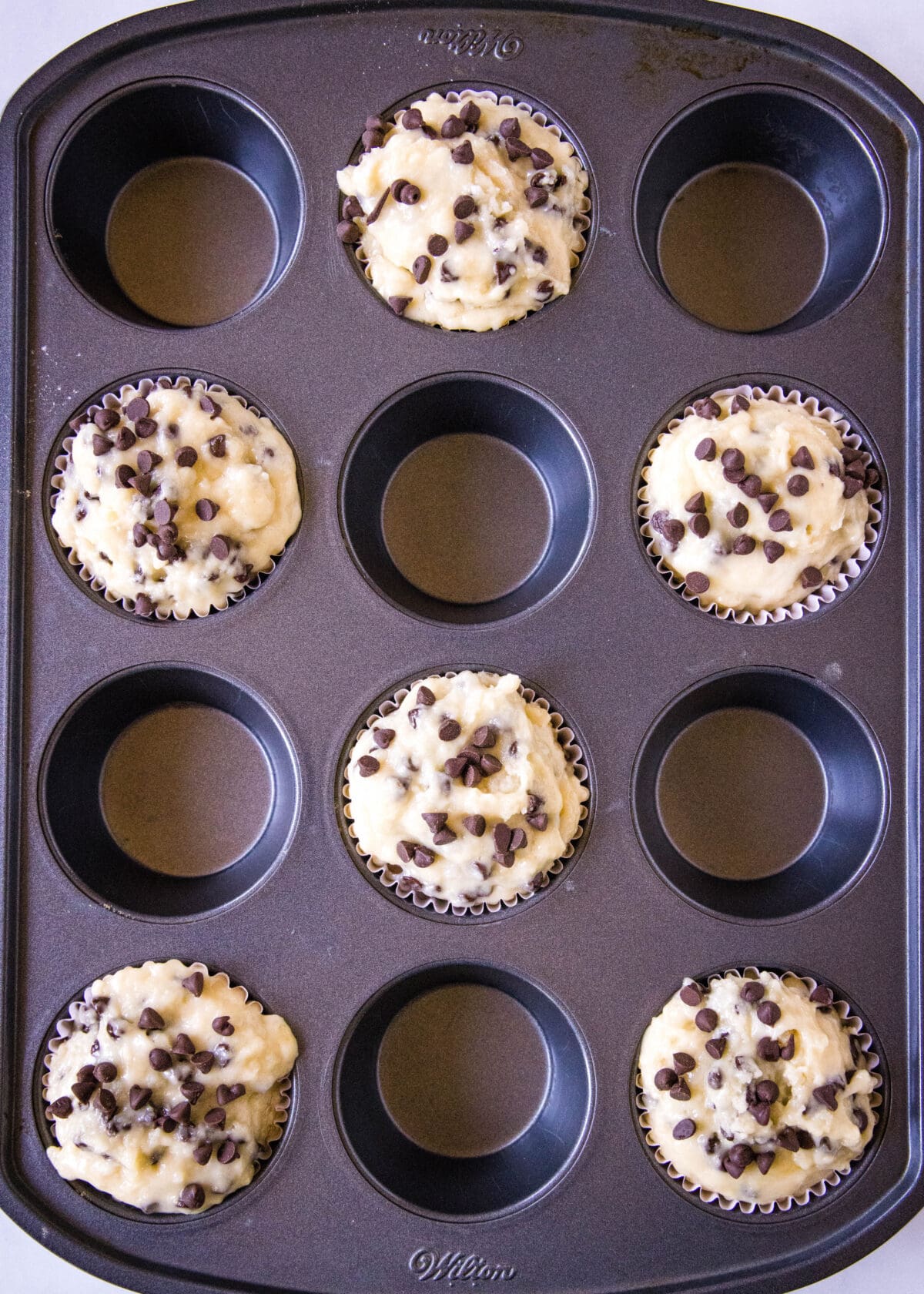 muffin tin filled with batter