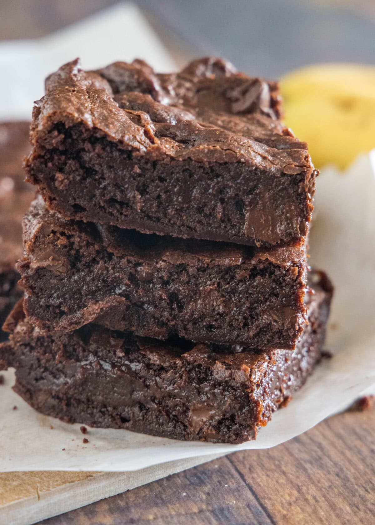 stack of banana brownies on cutting board