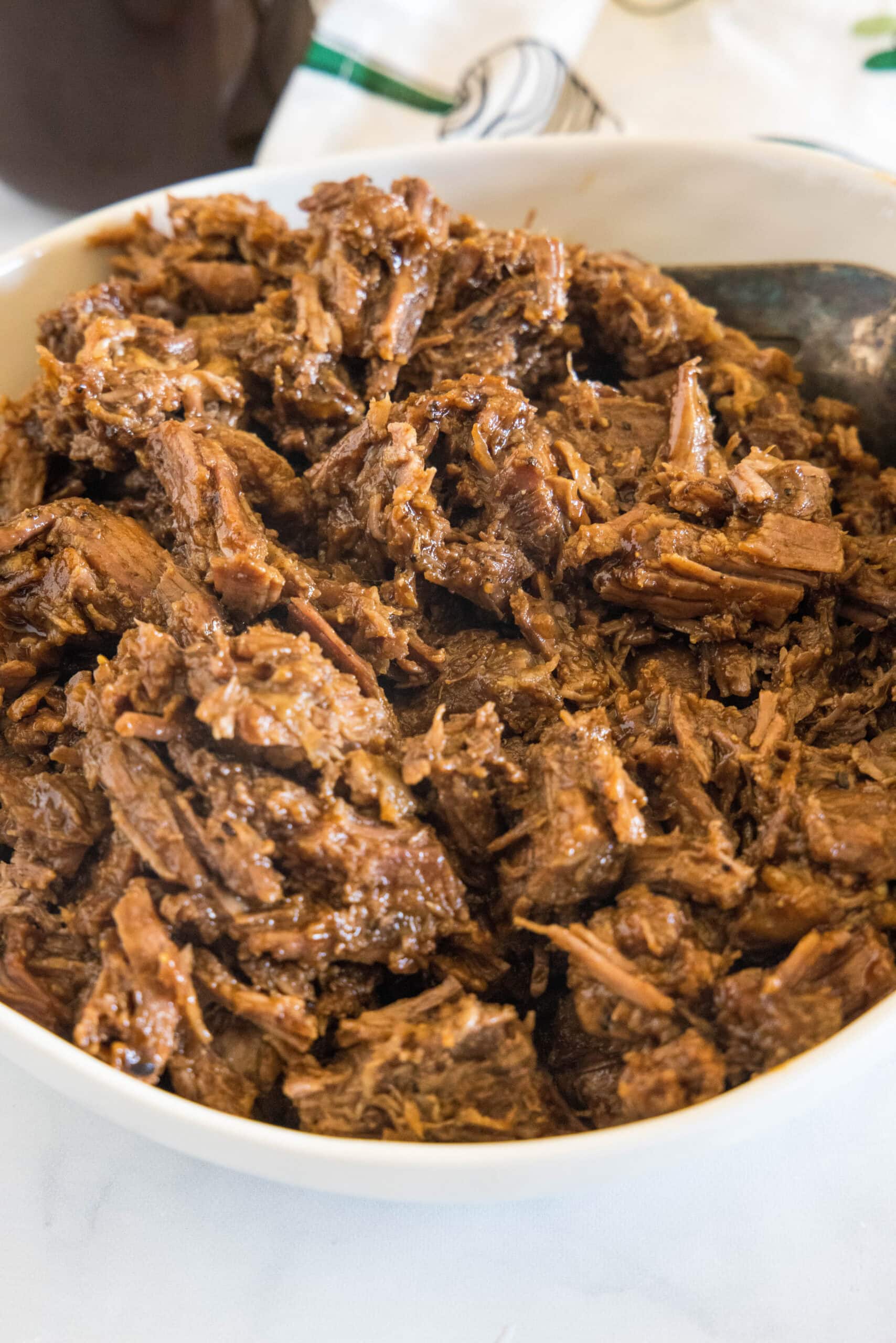 Shredded BBQ beef in a large bowl.