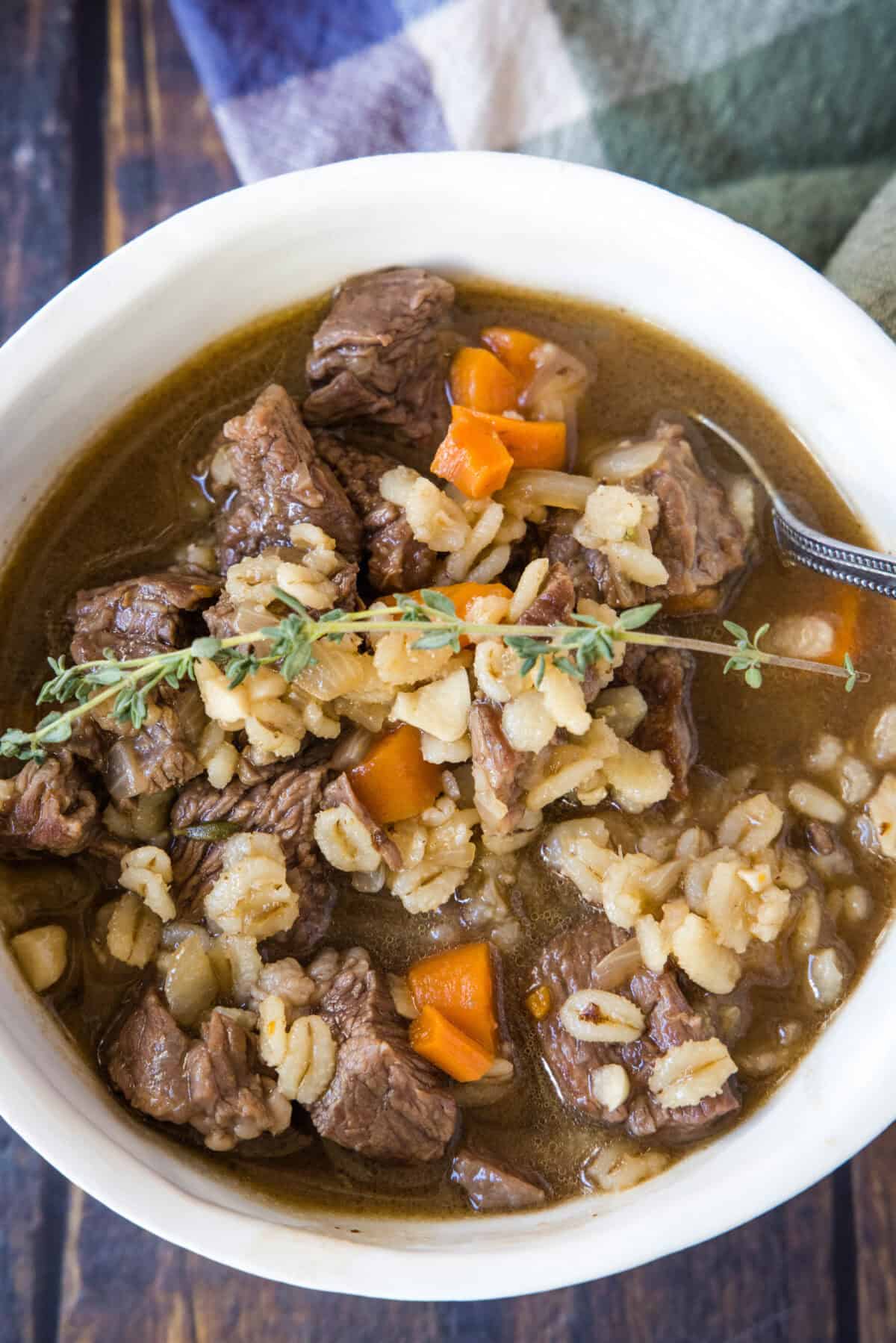 looking down on a bowl of beef barley soup