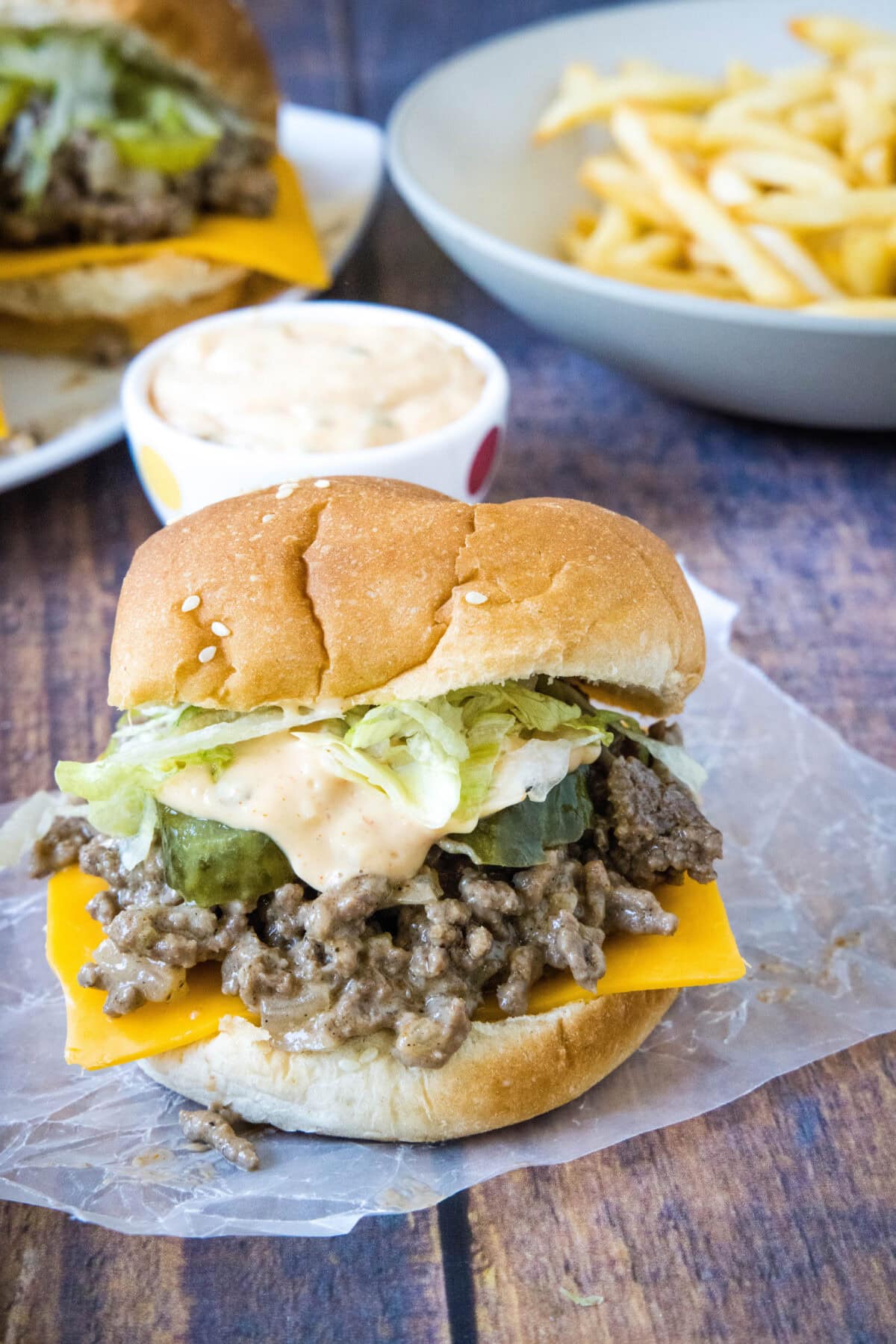 big mac sloppy joe with french fries in background