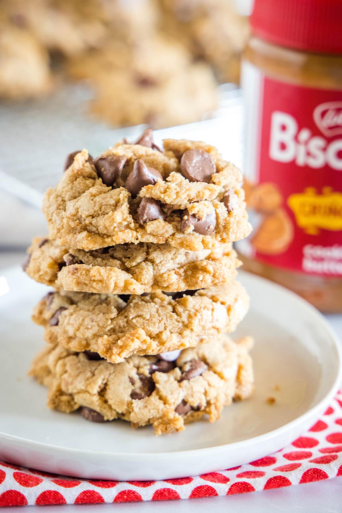 stacked biscoff chocolate chip cookies on a white plate