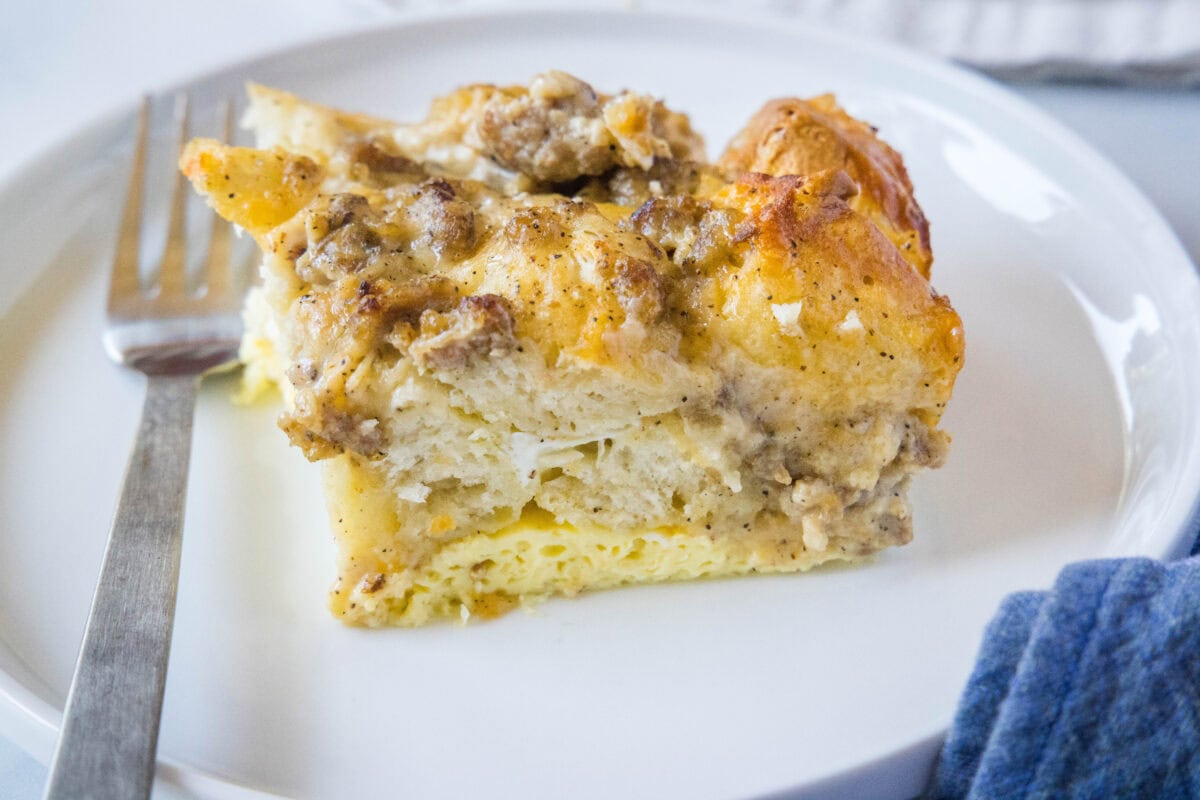 slice of biscuits and gravy on a white plate