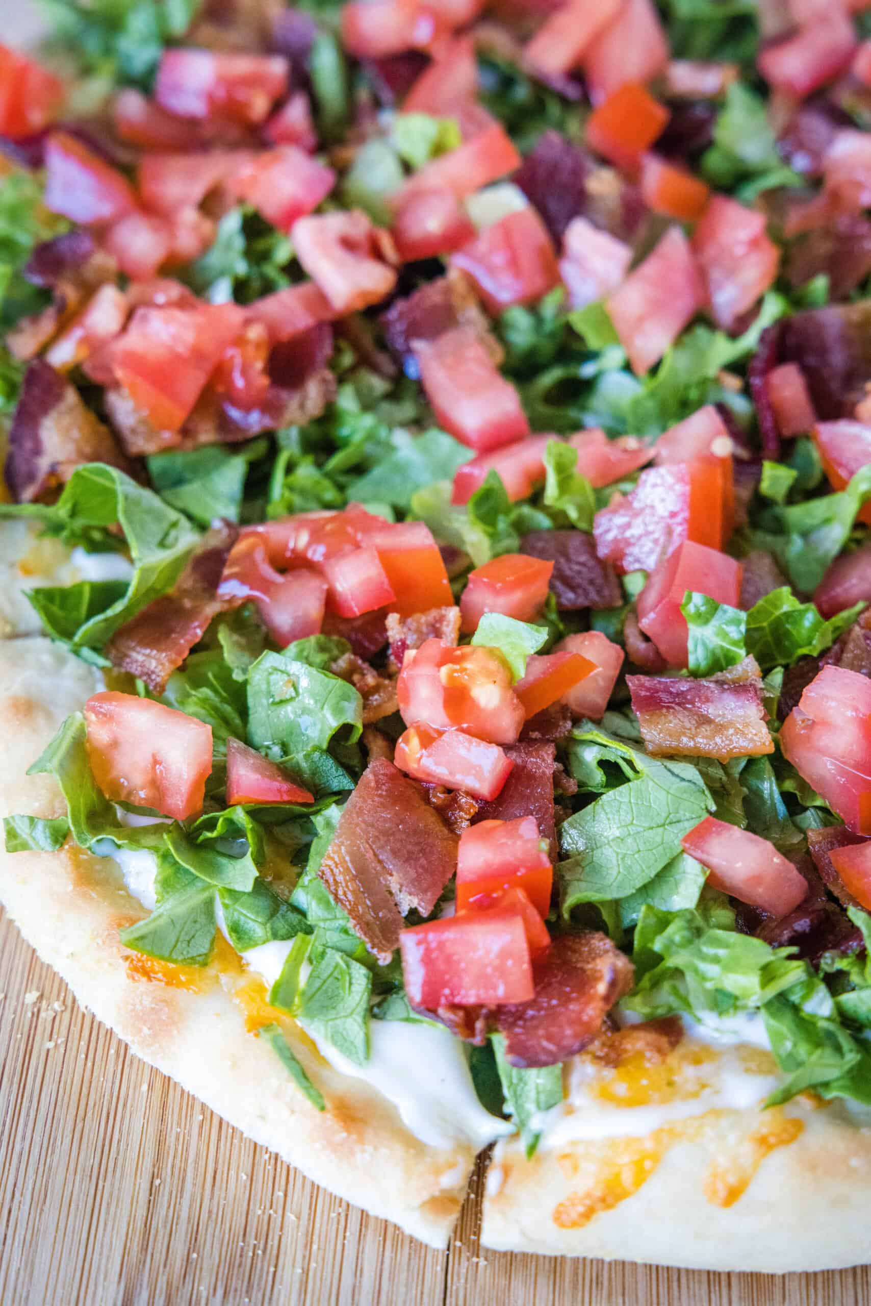 Close up of a BLT pizza.