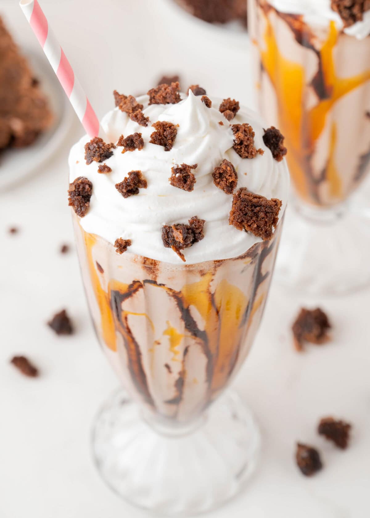 brownie milkshakes in a glass topped with whipped cream
