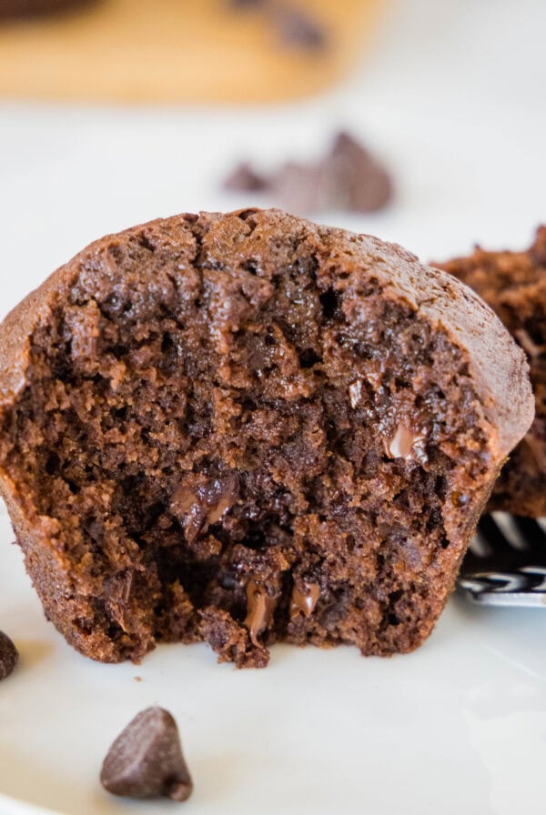 close up brownie muffin cut in half on a plate