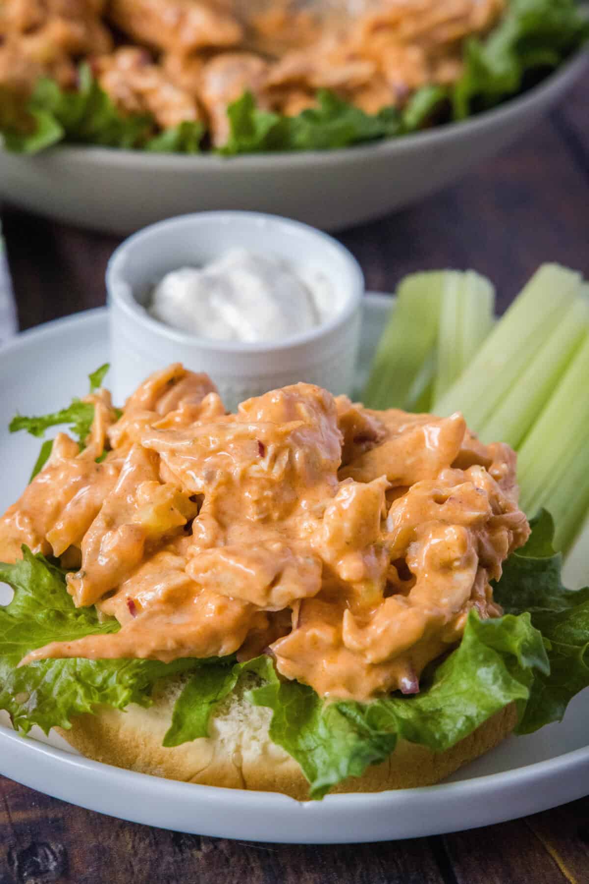 buffalo chicken salad on a bun with lettuce