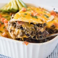 close up slice of burrito casserole on a spatula