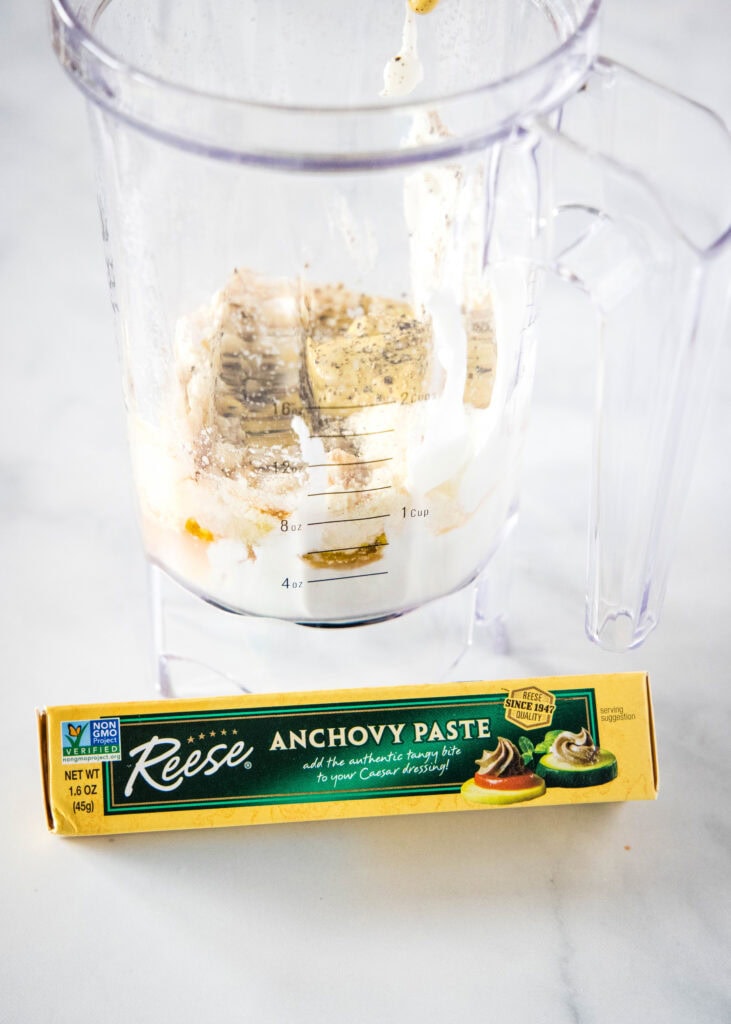 dressing in blender with anchovy paste box in front