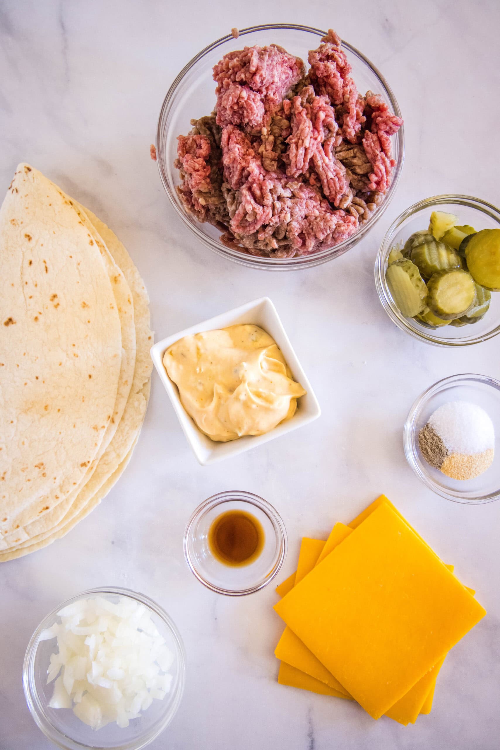 Ingredients for cheeseburger quesadillas.