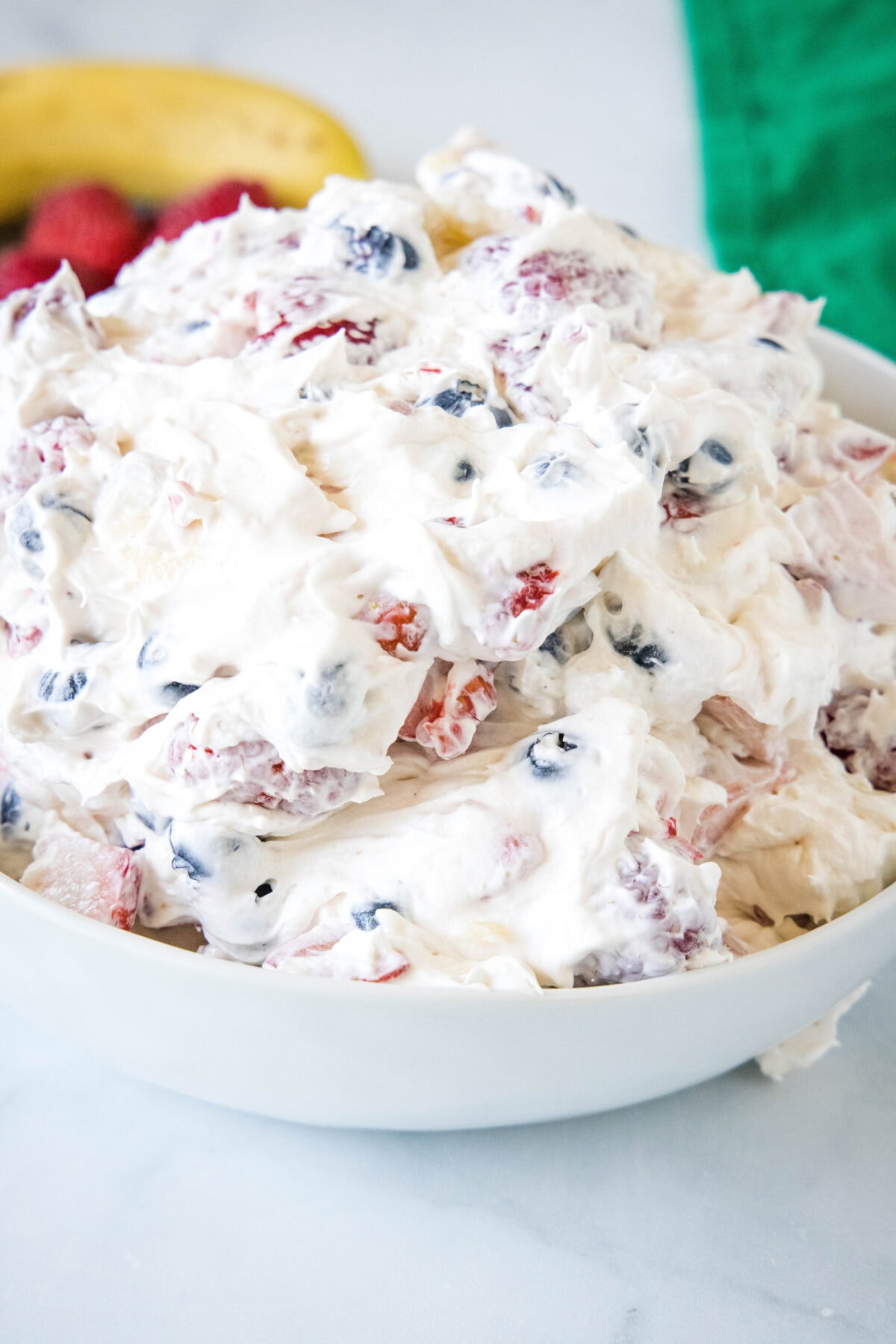 Cheesecake fruit salad in a bowl.