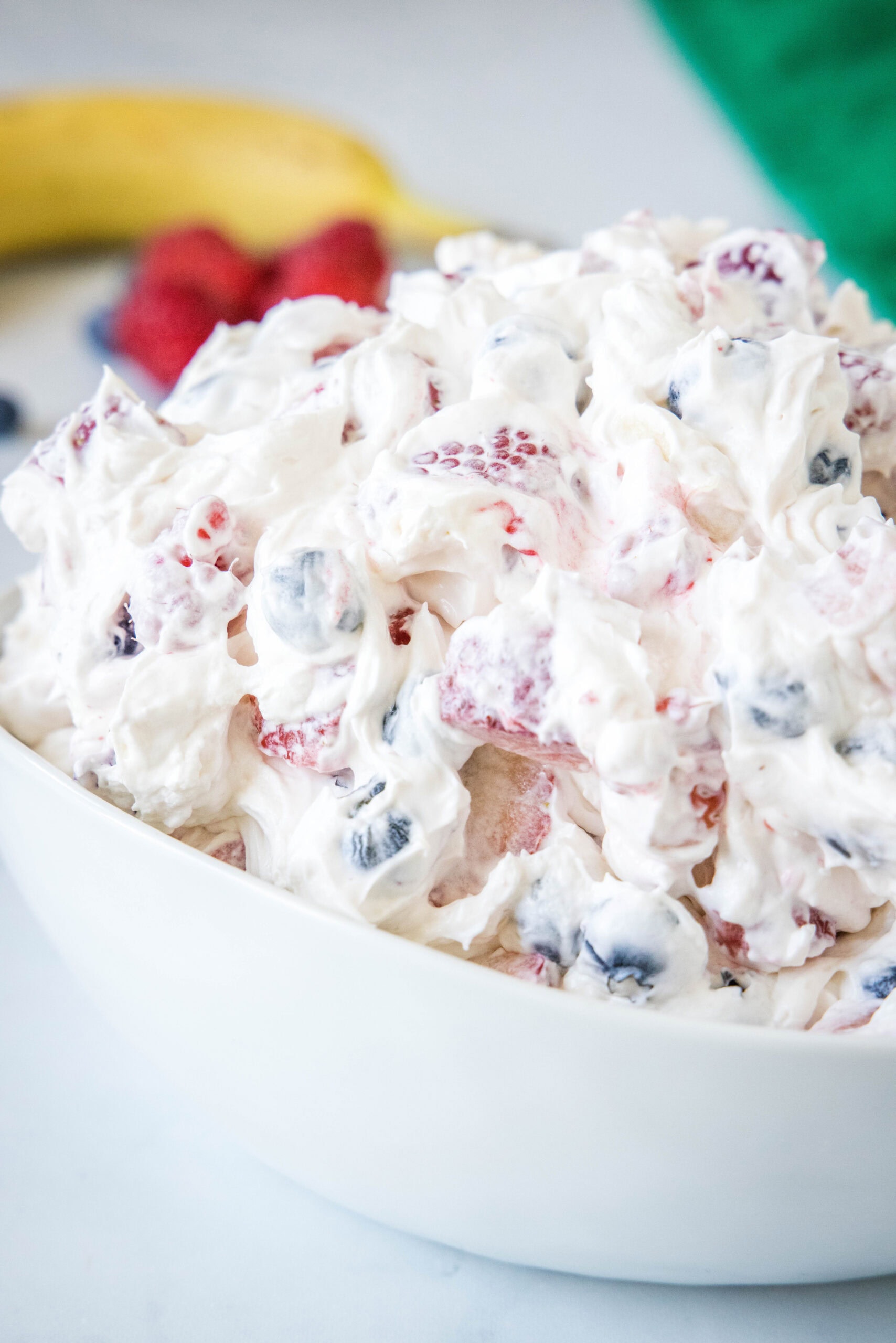 Cheesecake fruit salad in a bowl.