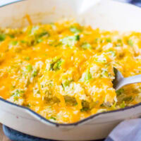 cropped in pic of rice casserole on serving spoons