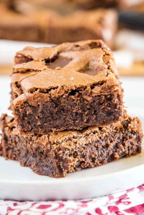 cropped close up of brownies on a white plate