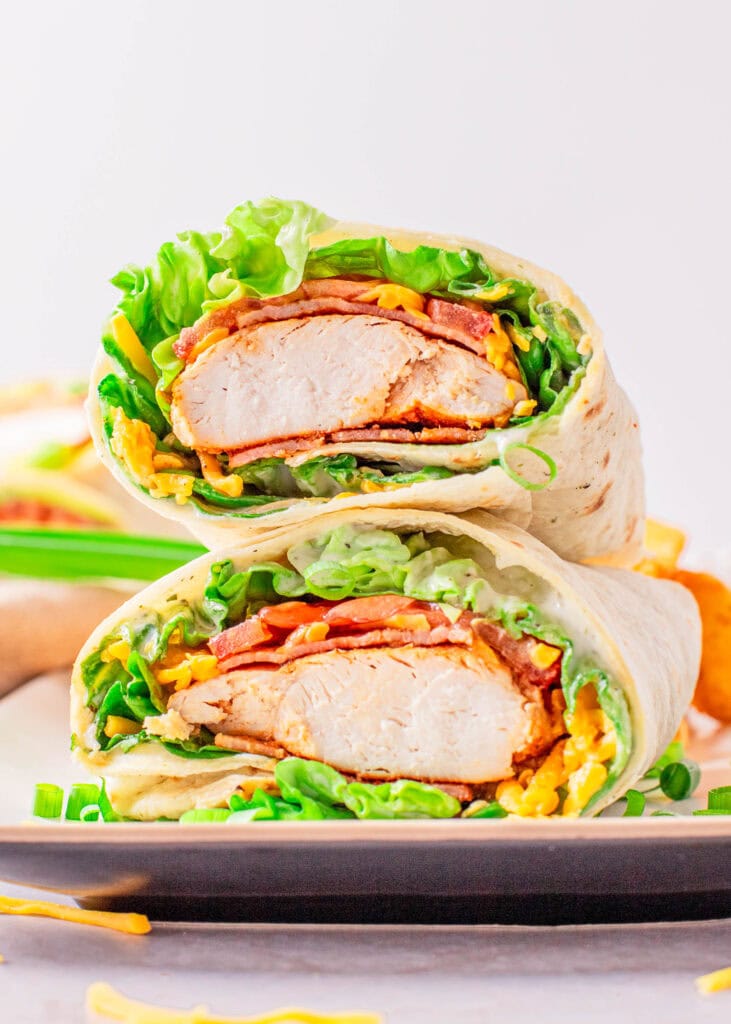 wrap cut in half stacked on white plate