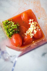 tomatoes, jalapeno and garlic in a blender
