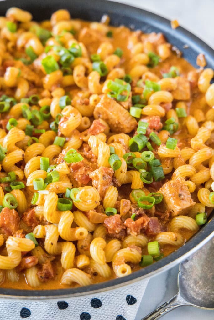 large skillet of pasta with chicken and chorizo