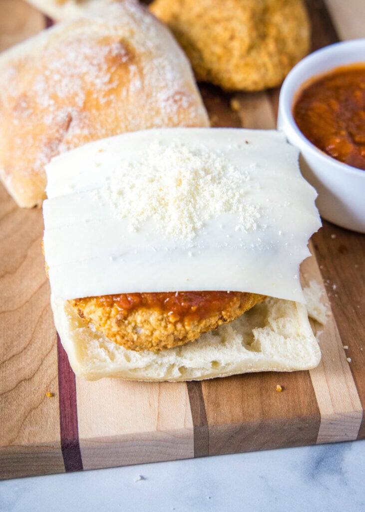 putting cheese on sandwich