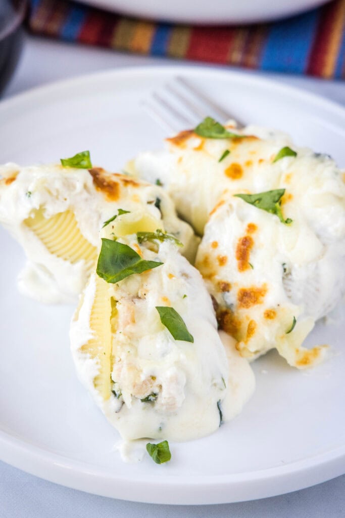 chicken stuffed shells on a white plate