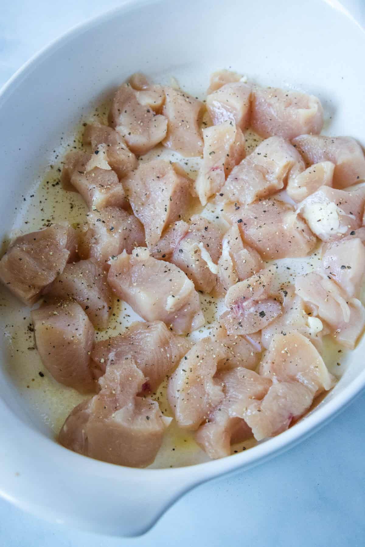 chicken arranged in baking dish.