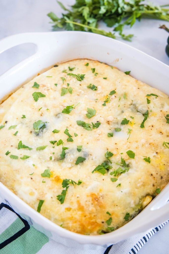 chili relleno casserole in baking dish garnished with cilantro