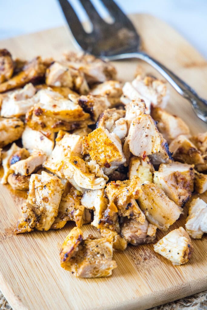 chopped chipotle chicken on a cutting board