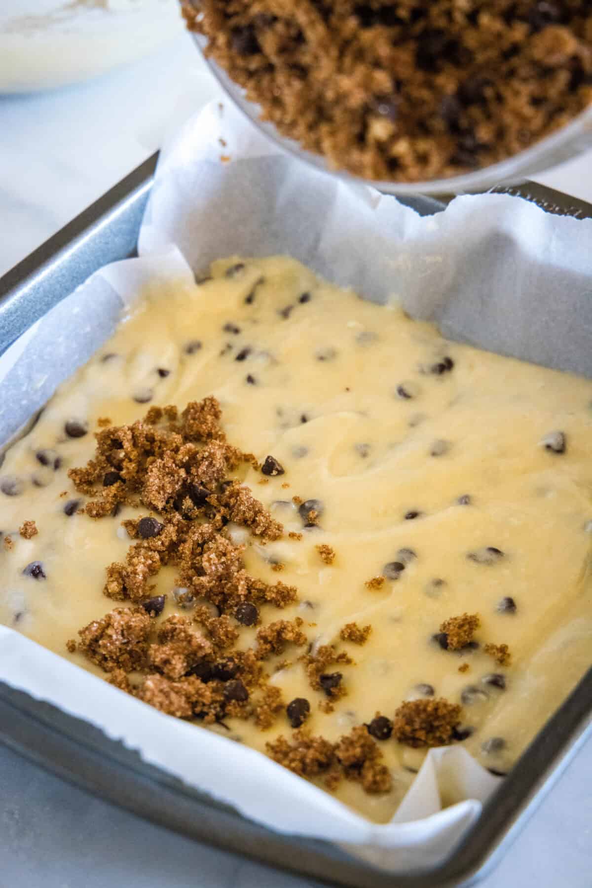 sprinkling streusel on cake batter