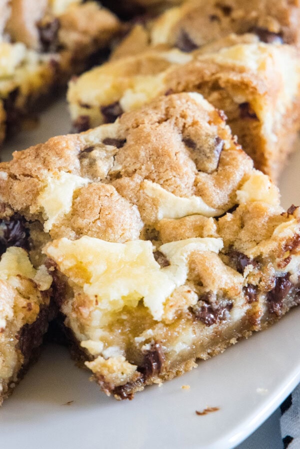 cropped close up chocolate chip cookie cheesecake bars