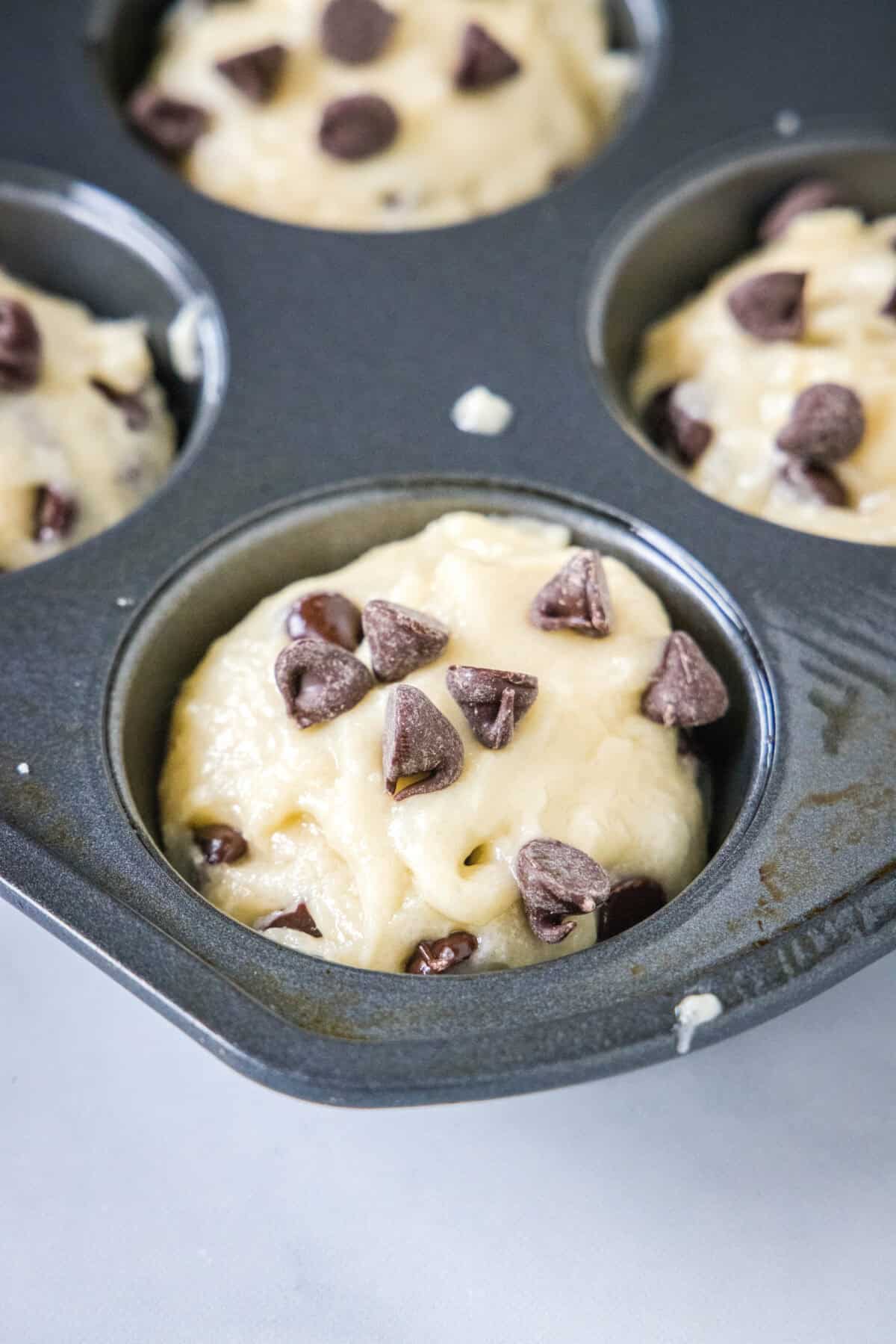 muffin batter in a muffin pan