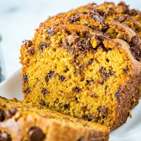 A close up of a piece of pumpkin bread on a plate
