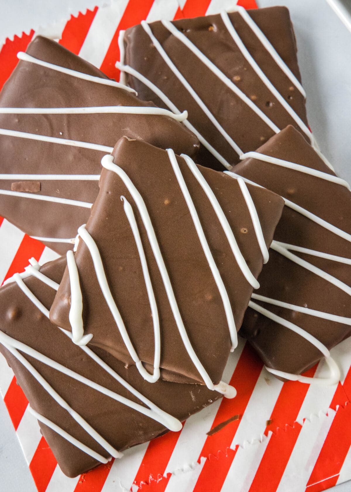 looking down on a tray of chocolate covered graham cracker squares