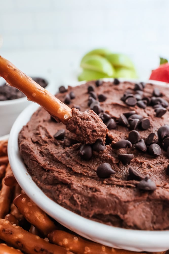chocolate hummus in bowl with pretzel stick