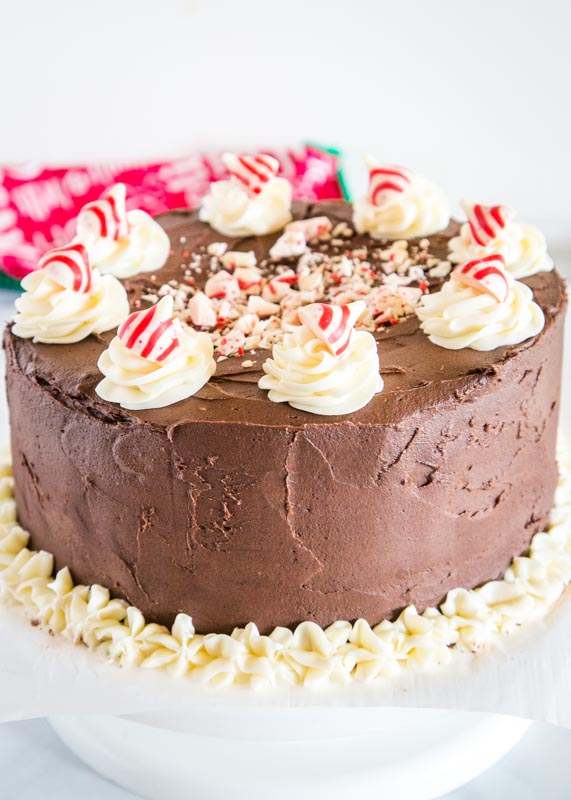 chocolate cake with white frosting and peppermint kisses on top