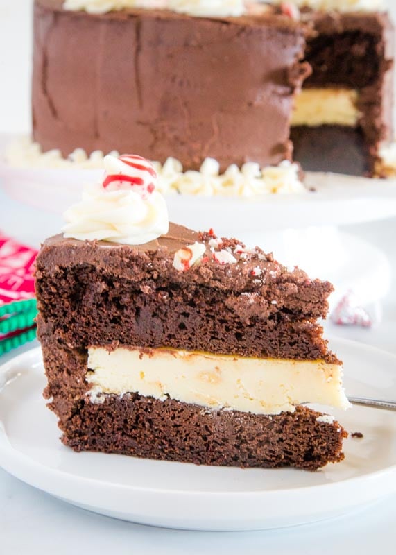 slice of chocolate peppermint cheesecake cake on white plate