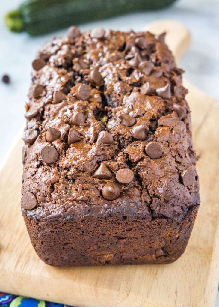 loaf of chocolate zucchini bread on cutting board