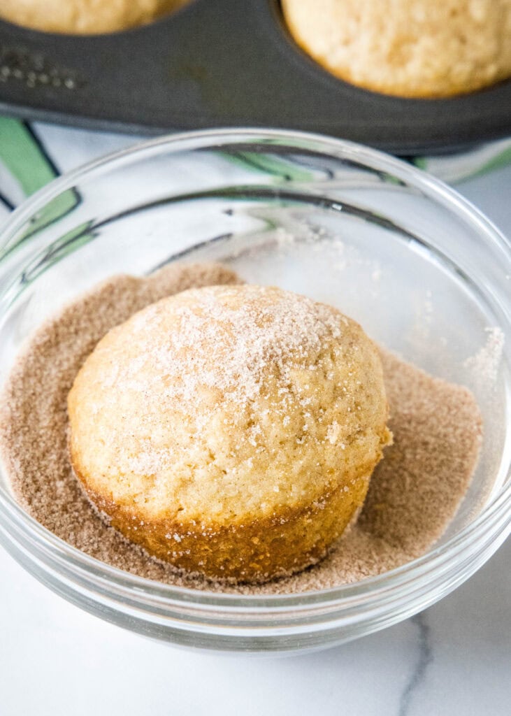 coating muffins in cinnamon and sugar