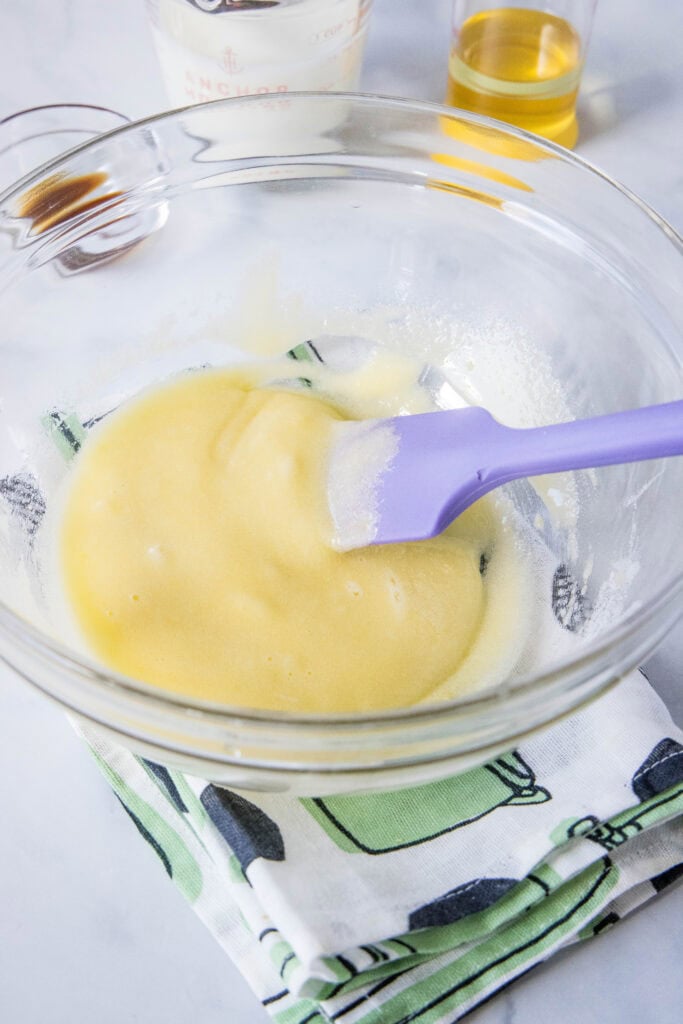 mixing eggs and sugar together in mixing bowl