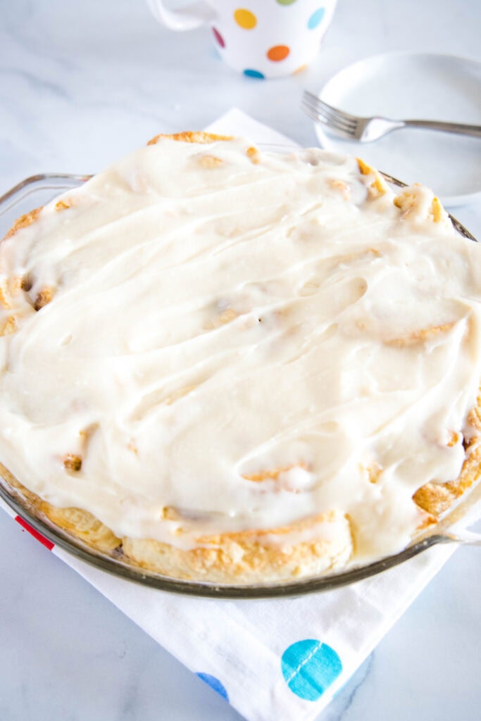 frosted no yeast cinnamon rolls in a pan