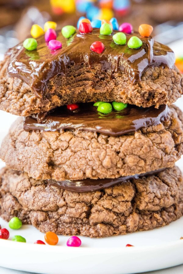 close up stack of chocolate cookies with bite taken out of the top one