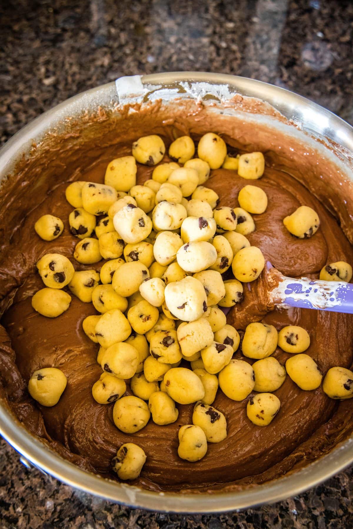 adding cookie dough balls to fudge